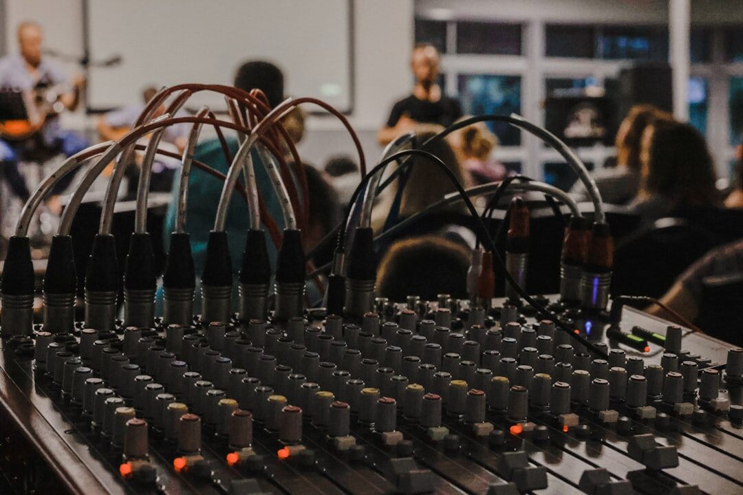 Professional broadcast microphone and audio mixer on a desk