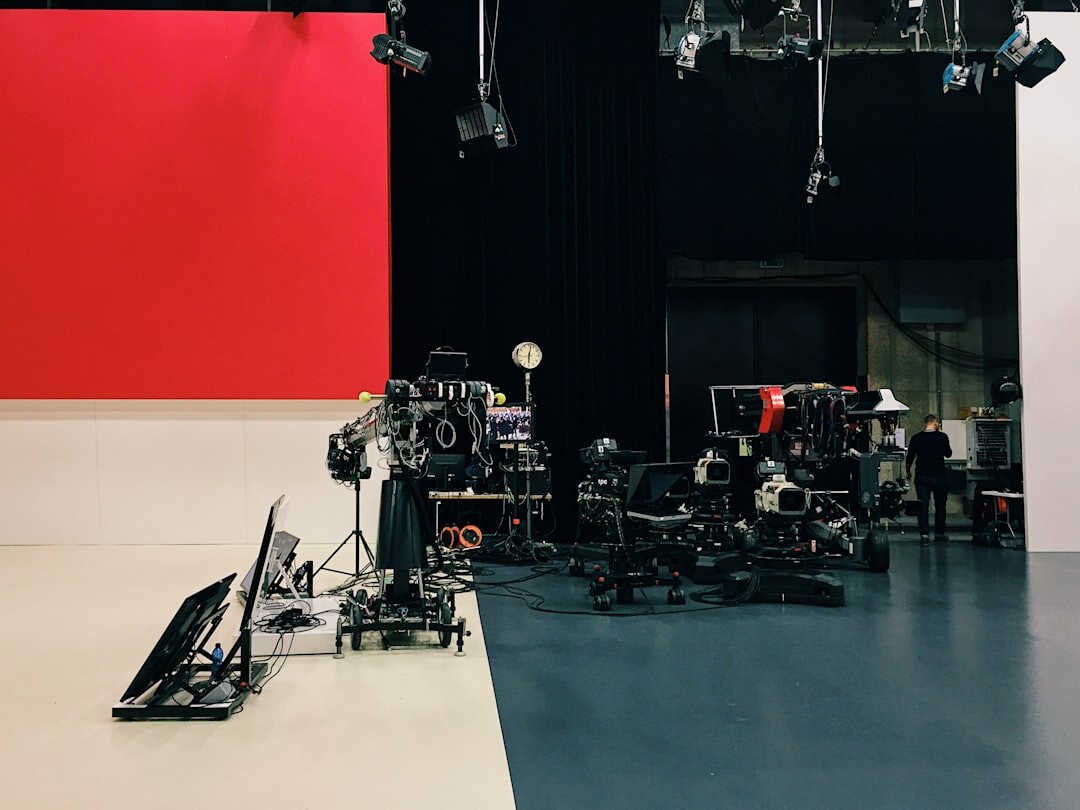 Empty television studio lit with colorful stage lighting